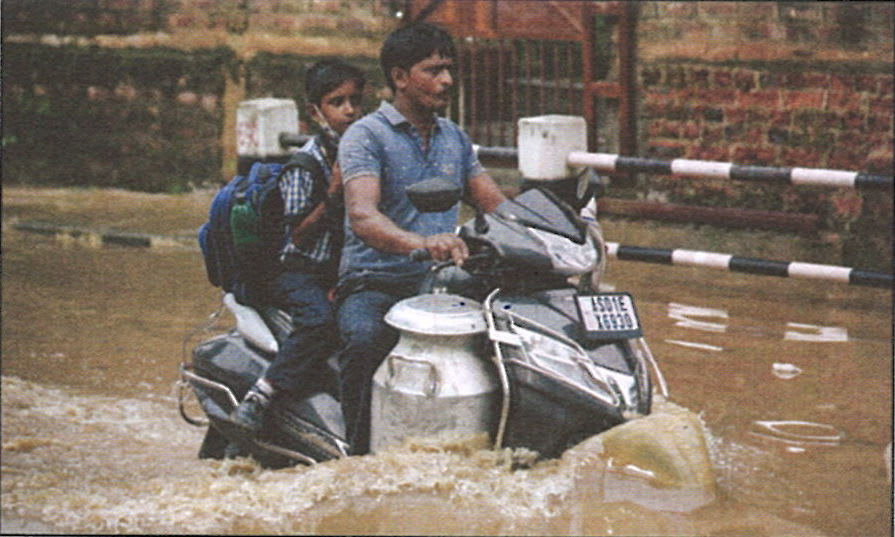 Study the picture on the right. Briefly explain what could be the cause of this calamity and what could be done to bring relief. Chapter 6 Climate, Total Geography ICSE Class 10